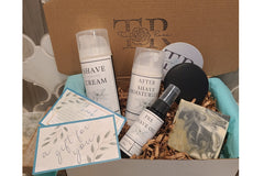 The subscription box includes an all-natural men's shave set, soap, and shampoo bar.  Lightly scented, or unscented options.