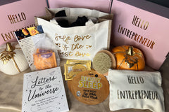 November's End-of-Year Success Kit: Shop Bag, Makeup Bags, 'Letter to the Universe' Book, Dead Skin Brush, Ginger Tea, Facial Mask.