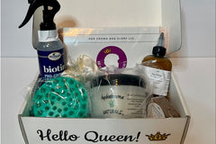a curation of natural hair products including a Her Crown and Glory microfiber hair towel wrap and scalp massager 