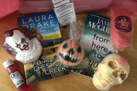 Bubbles & Books subscription box featuring a romantic novel, handmade soap, and bath products for relaxation