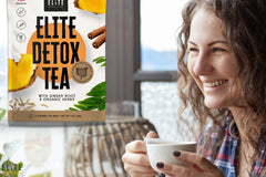 A young lady happily drinking a cup of Elite detox tea with natural organic herbals that support colon cleanse, digestive system, gut health