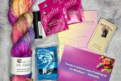 June 2023 box--You can always expect a high quality hand dyed yarn, tea samplert, and 3-4 goodies in a monthly box.