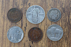 Examples of collectible American coins included in gift boxes, including a buffalo nickel, Indian head penny, and standing Liberty quarter.
