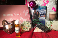 Bubbles & Books subscription box featuring a romantic novel, handmade soap, and bath products for relaxation