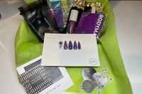 Example Box: Celestial Vibez. Packaged in signature neon green tissue paper. Comes with nail set, stickers, jewelry, beauty items, etc.