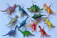 Colorful assortment of unique earrings including food and whimsical designs in the Monthly Earring Mania subscription box