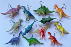 Colorful assortment of unique earrings including food and whimsical designs in the Monthly Earring Mania subscription box