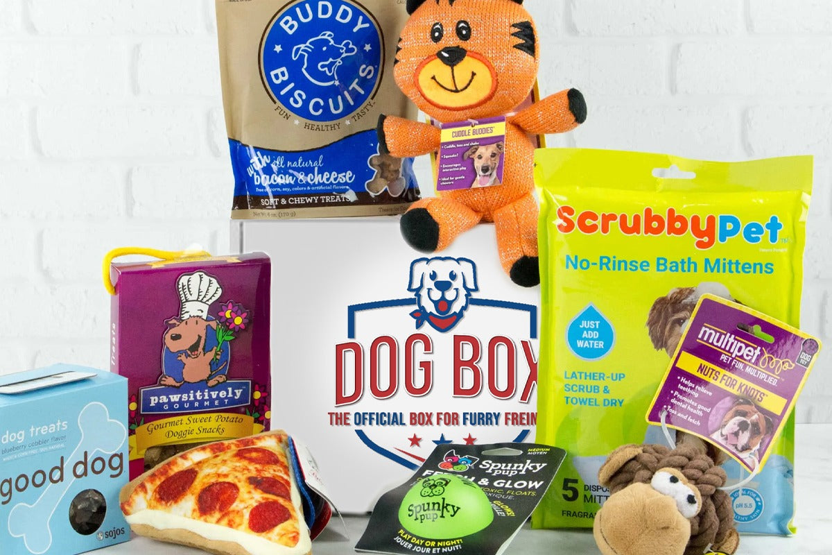 Variety of premium dog treats, toys (animals and pizza), and accessories (grooming, potty, clothes). 