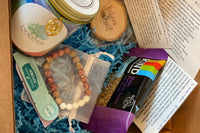 Each reiki infused candle comes with a charm on a cord to wear at a later date. Each box is made to fit the months theme