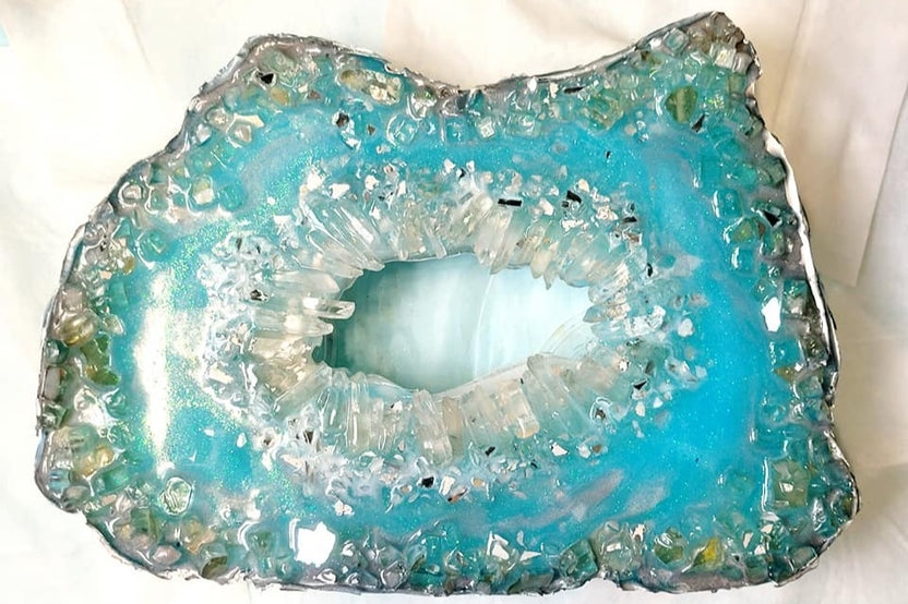 A vibrant green resin art piece with crystal accents, featured in The Joy of Resin Art subscription box