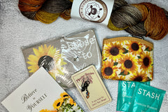 August 2023 box-- You can always expect a carefully curated box with great yarn and 3-4 fun notions with a tea sampler.