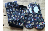 A fun pair of crew and no-show socks, with cats that have laser beam eyes.  The background is black with stars.