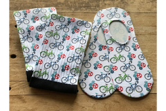 Crew Socks, & No-Show Socks in a bicycle & gear print. The background is white, contrasting to the green & blue bicycles, & red & teal gears