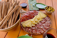 The IbericoTapas box spread, including an exquisite selection of Iberico cured meats, manchego cheese, manzanilla olives and breadsticks.