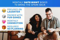 Couple laughing and playing games together with a Date Night Box subscription on a cozy couch