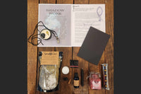 BOX CONTAINING WITCH BOX ITEMS FOR THIS THEME: SHADOW MAGIC                                               