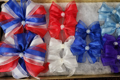 3 sets of 2. Guaranteed the red, white, and blue bow of the month plus two more sets of stunning summer hair bows.