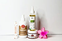 a curation of products for Her Crown and Glory's Spring Loc Box 2024 standing in front of a white background