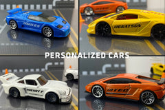 The Hot Wheels monthly subscription box containing a personalized car with name, display case, additional new cars, and accessories.