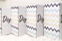 photo of the outside of the baby discovery boxes to show branded pattern.  boxes are lined up in a row. 