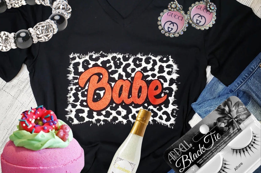 An Oliver Christopher's Boutique black t-shirt with the word "babe" - a perfect gift.
