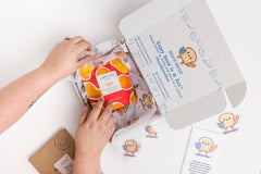Read It & Eat Blind Date with a book.  Each box contains a food story, an artisanal snack, and a $5 donation to fight hunger in Buffalo, NY