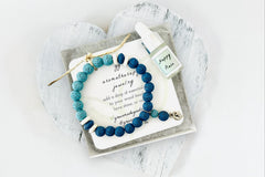 Blue Lava Diffuser Bracelet with Silver Moon Charm in White Gift Box with Aromatherapy Instruction Card and Happy Place Mini Oil Dropper.