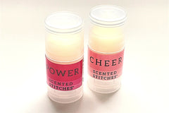 Examples of the goodies we enclose with each kit include wool wash, lip balm, candles, and stitch markers - The Spinning Hand