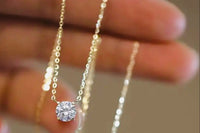 One beautiful Quarter carat weight flawless princess cut diamond pendant On a dainty 10k gold necklace featured in our upcoming February box