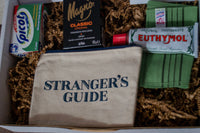 Photograph includes Euthymol toothpaste, Mango Classic soap, a Stranger's Guide bath case, Picot antacid, and a South Korean "Italy" towel.