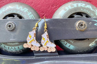 Colorful assortment of unique earrings including food and whimsical designs in the Monthly Earring Mania subscription box