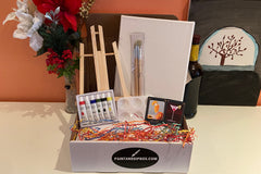 Enjoy a Paint and Sip Box or give as a gift. Each box contains an easel, a canvas, paint, a tray, and brushes. 