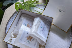 Spring Subscription Box, by Create Elements, filled with two Oatmeal Bath Bombs and Moisturizing Lavender Shampoo Bar. 