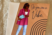 Brown background with beautiful black woman wearing  blue jeans, magenta blazer and fashionable accessories.  Card says Sis you are a Vibe.