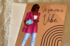 Brown background with beautiful black woman wearing  blue jeans, magenta blazer and fashionable accessories.  Card says Sis you are a Vibe.
