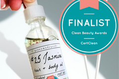 The Jasmine Hair + Body Oil by Greenmade goods with the Clean Beauty Award Seal in the right hand corner.