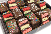Nettie's Craft Brownies rainbow cookies sprinkles chocolate dipped side view of fifteen cookies in box.