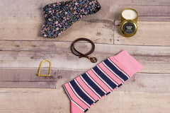 A SprezzaBox monthly subscription box featuring a watch, tie, socks, and a wooden comb for men's accessories