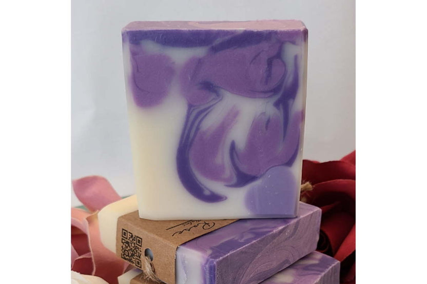 Tranquil Rose purple and white handcrafted soap bar featuring a beautiful swirl design and small-batch artisan craftsmanship.