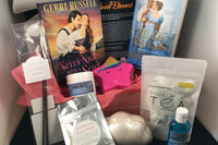 Bubbles & Books subscription box featuring a romantic novel, handmade soap, and bath products for relaxation
