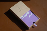 A thejewelpick gift card in a The Jewel Pick box on a table.