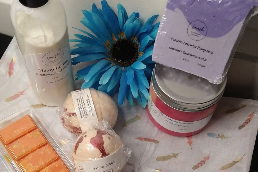 A gift box of Lavish luxury bath and body products with a flower on it.