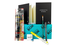 SketchBox subscription box featuring art supplies like markers, a notebook, and a brush for creative projects