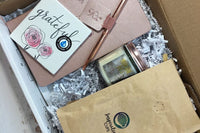 - ActionPlanner 
- 12oz Bag of Coffee 
- Coaster 
- Candle
- Pen 

*Items varies and theme changes. 