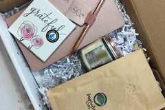 - ActionPlanner 
- 12oz Bag of Coffee 
- Coaster 
- Candle
- Pen 

*Items varies and theme changes. 