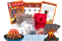 Two children engaged in the I'm The Chef Too! cooking kit, creating galaxy donuts with colorful icing and sprinkles