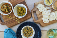 Seafood Tapas box, including Lobster Pate spread, Mussels in Pickled Sauce, Cockles in Brine, Vegan Crackers and Anchovies Stuffed Olives.