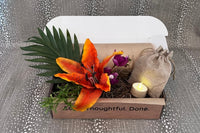 Entry Envy August Refill Decor Kit- pictured: orange floral pick with greenery, tea light on pick, moss. 