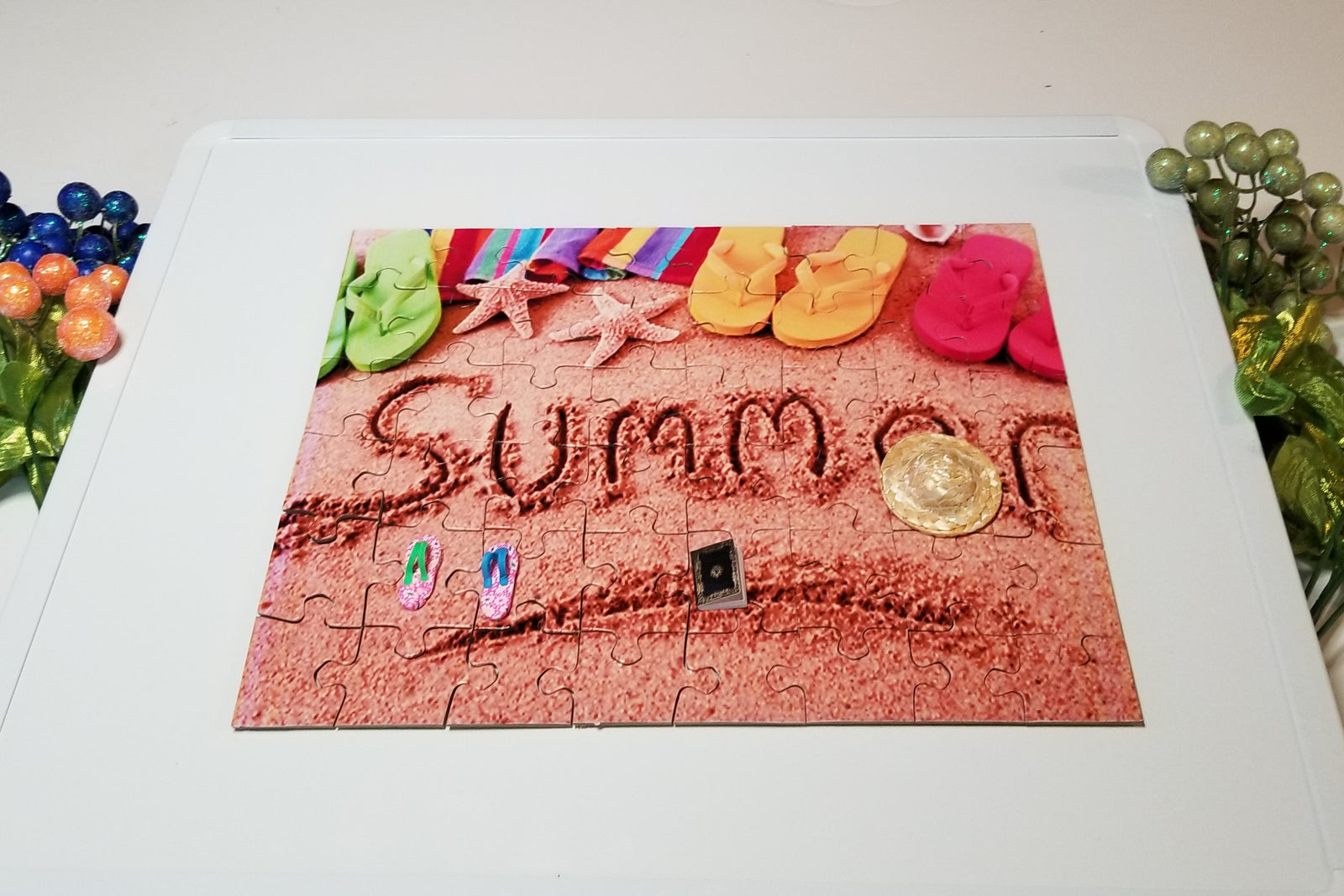 Summer sensory puzzle featuring a summer hat, sandals, and summer reading book.  Puzzle is magnetic as is MagDesk Lap desk.