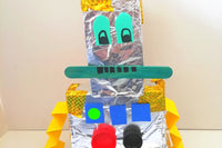 Crafted a futuristic robot using recycled materials! Glowing LED eyes, shiny metal body, and moving arms. A tech-savvy creation!